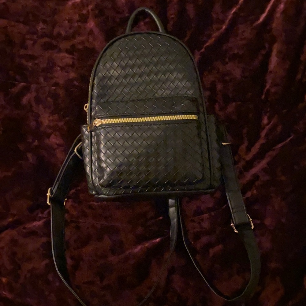 Selling LD black and gold mini backpack for $35